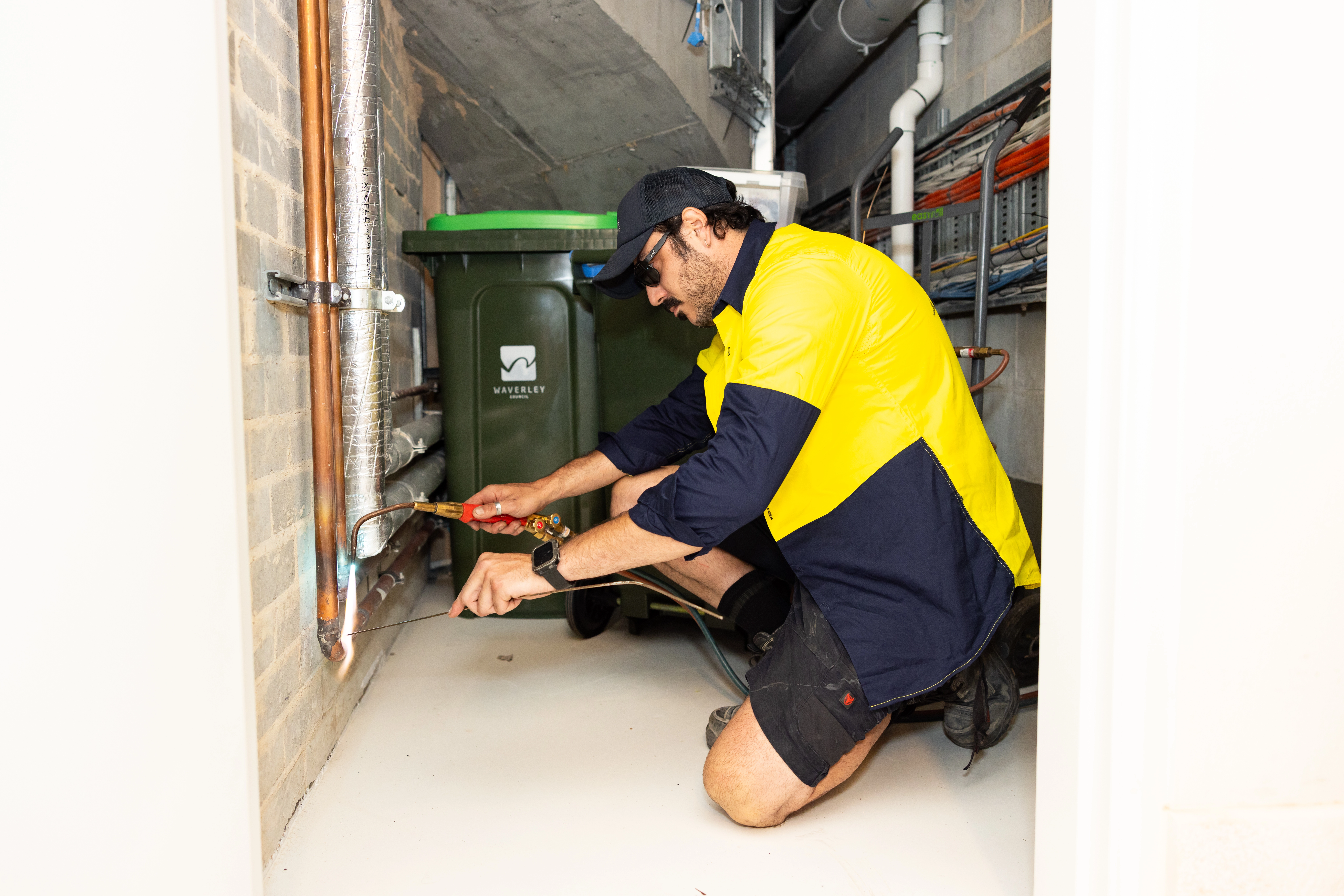 Gas specialist checking and adjusting meter connections