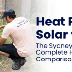 A plumber inspects outdoor water pipes while comparing heat pump, solar, and gas hot water systems for Sydney homeowners.