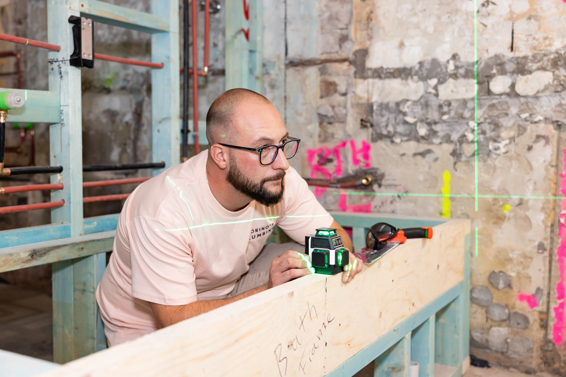 Trusted Guy Plumber measuring